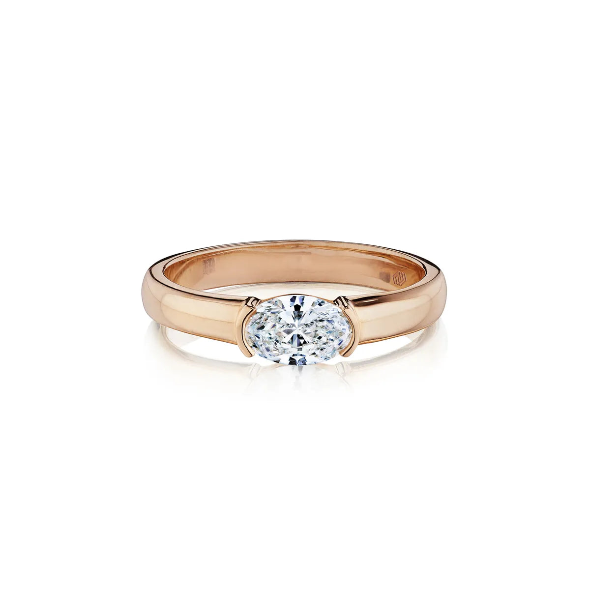 18k gold diamond solitaire ring band with oval cut diamond.
