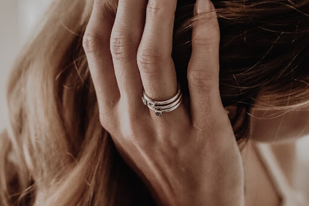 woman with fashion ring stack