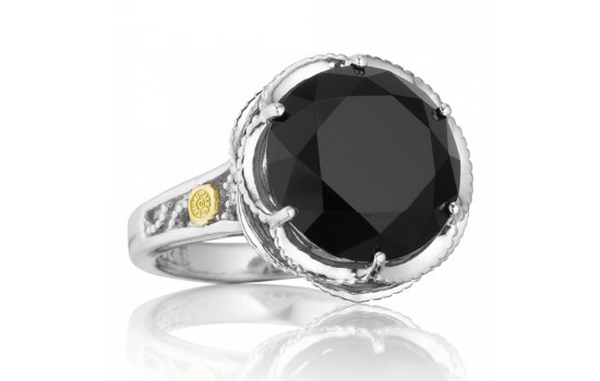 A silver and gold fashion ring featuring a large black onyx gemstone