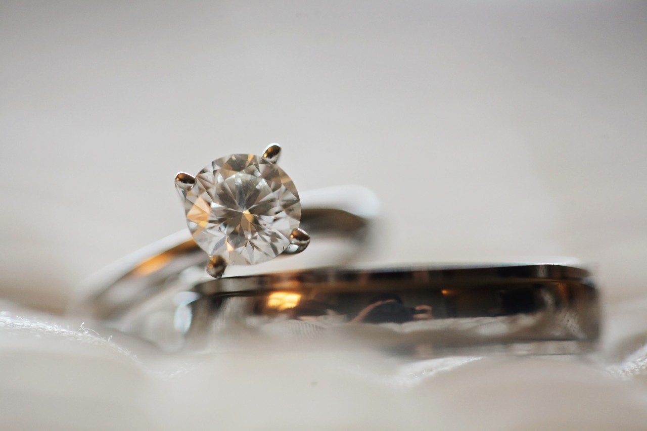 a diamond solitaire engagement ring and a wedding band